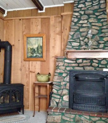 Fireplace and stove in Mad Creek Guesthouse, Bed and Breakfast, Inn, Hotel - 40 miles west of Denver, CO